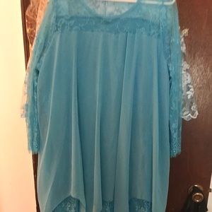 This dress is a beautiful blue color and lace.